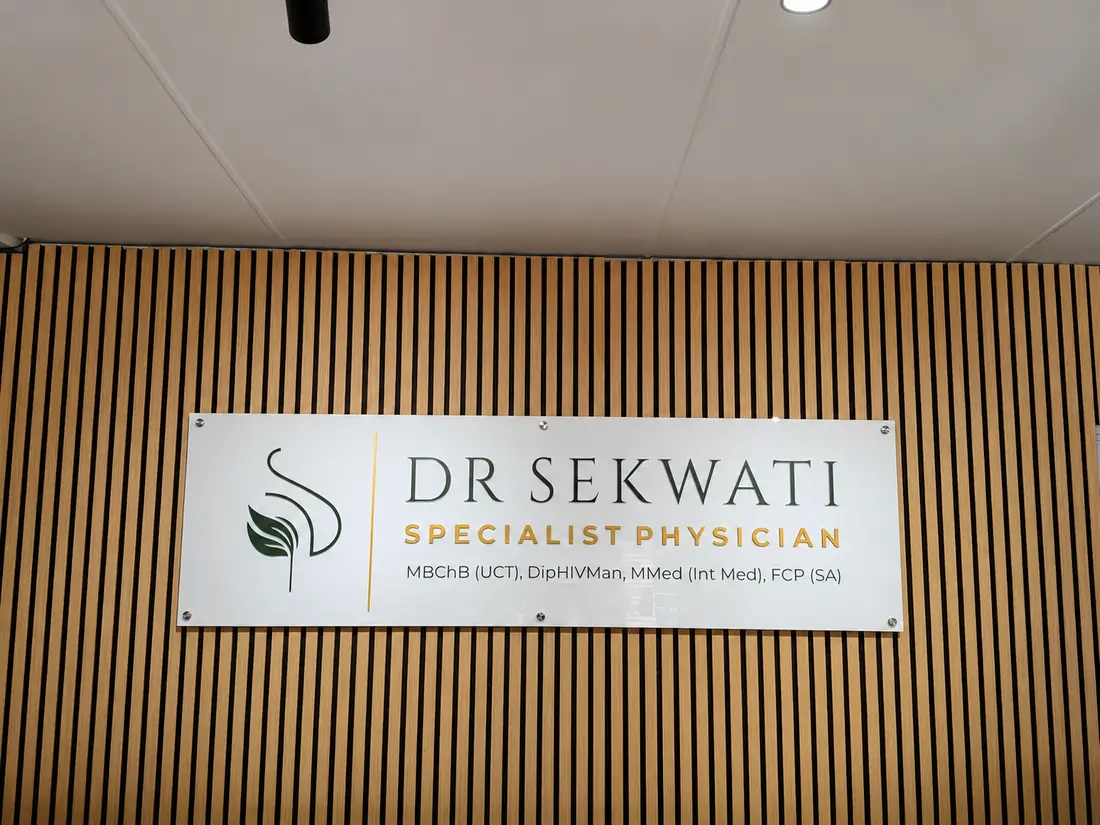 Dr Sekwati Specialist Physician sign on a timber slat feature wall